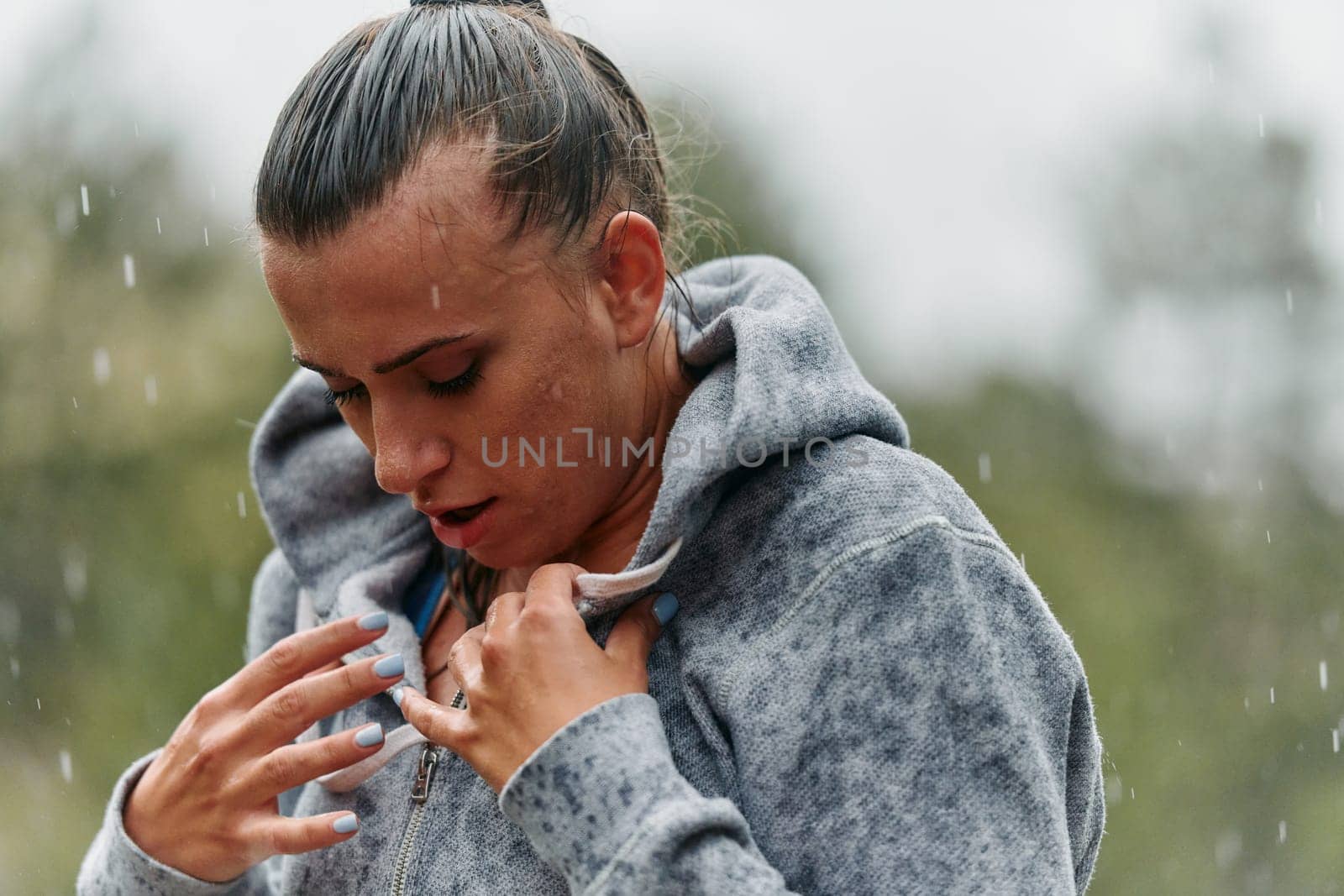 Woman Resting in the Rain After Intense Run by dotshock