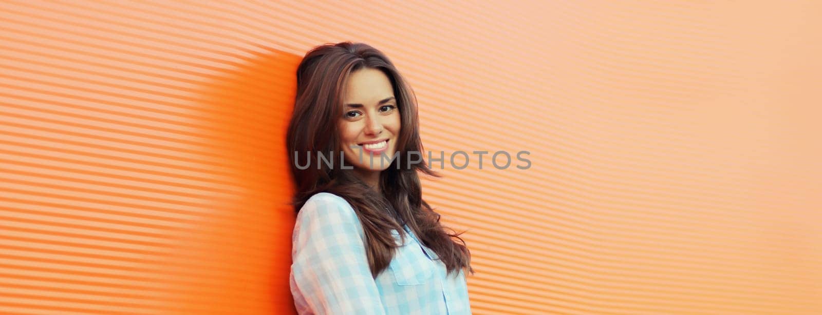 Portrait beautiful happy smiling brunette young woman posing in the city by Rohappy