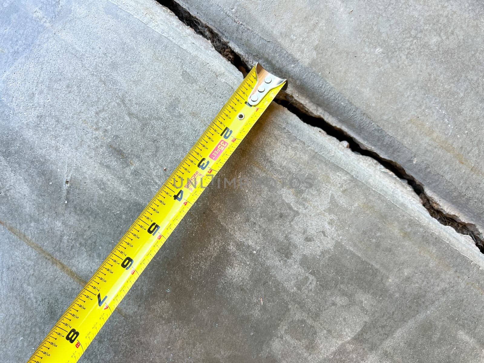 Measuring Concrete Joint Width in Driveway Repair by arinahabich