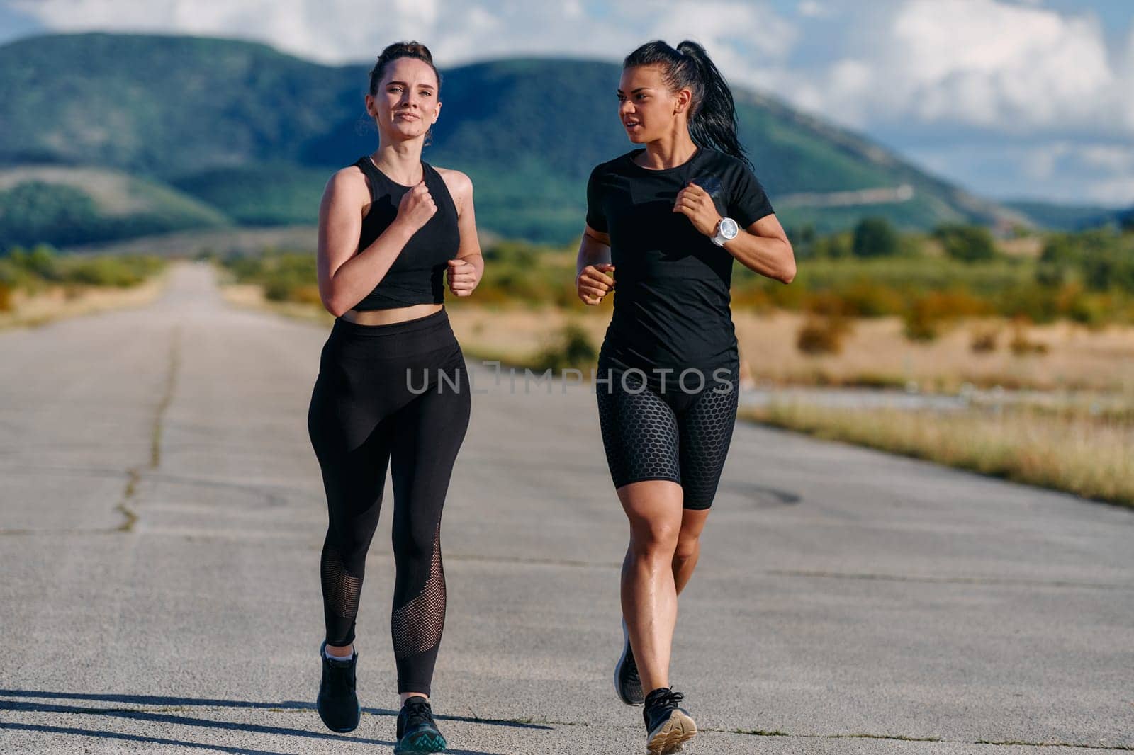 Two friends jog side by side on a sunny day, strengthening their bodies for life's extreme challenges, embodying the power of friendship and determination