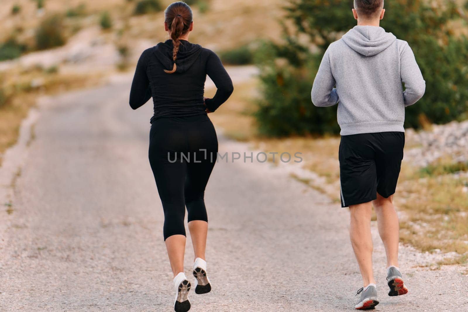 A Couple's Energizing Morning Run in the Mountains by dotshock