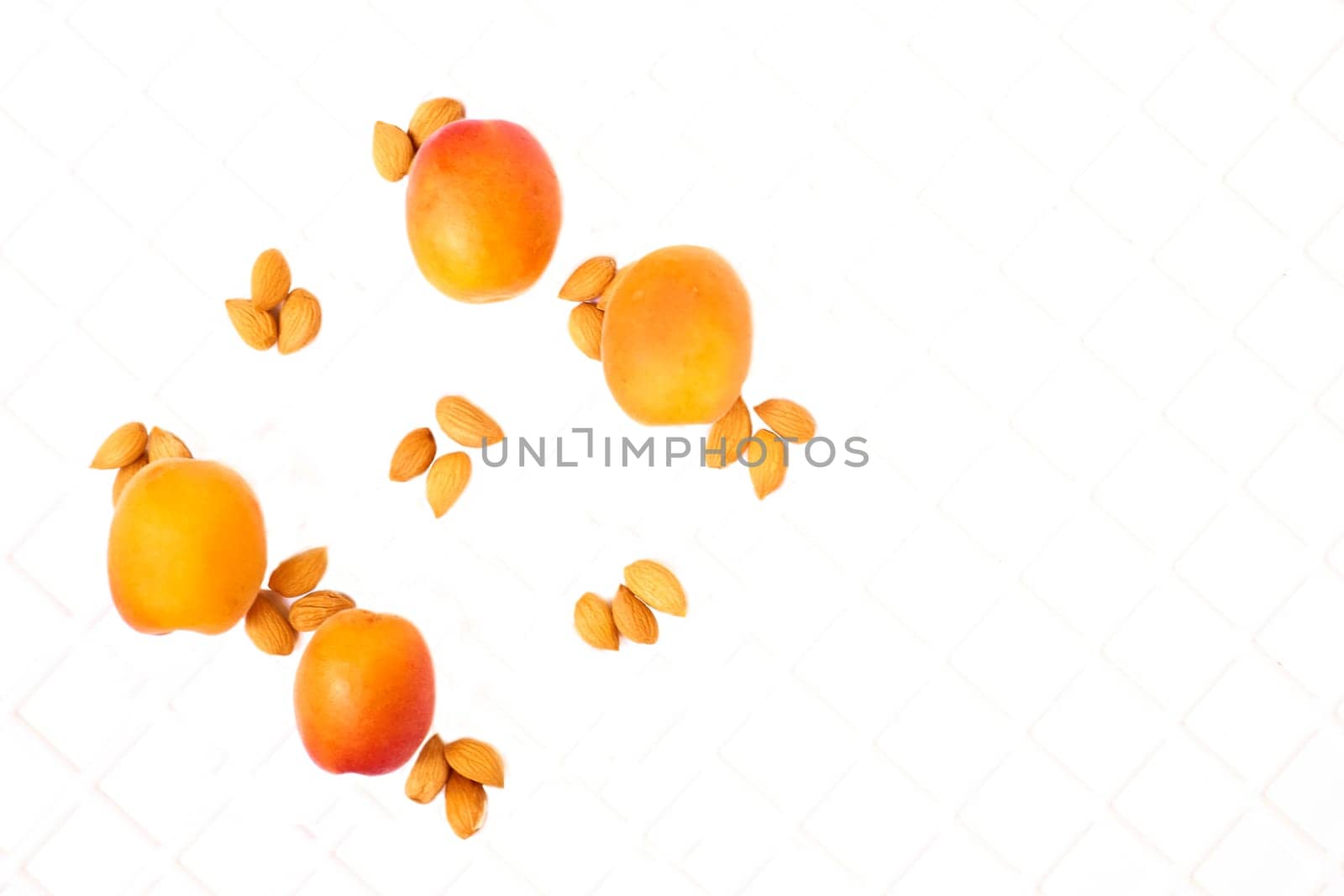 Taste of summer.Fresh ripe apricot fruits, kernels isolated on white by jovani68