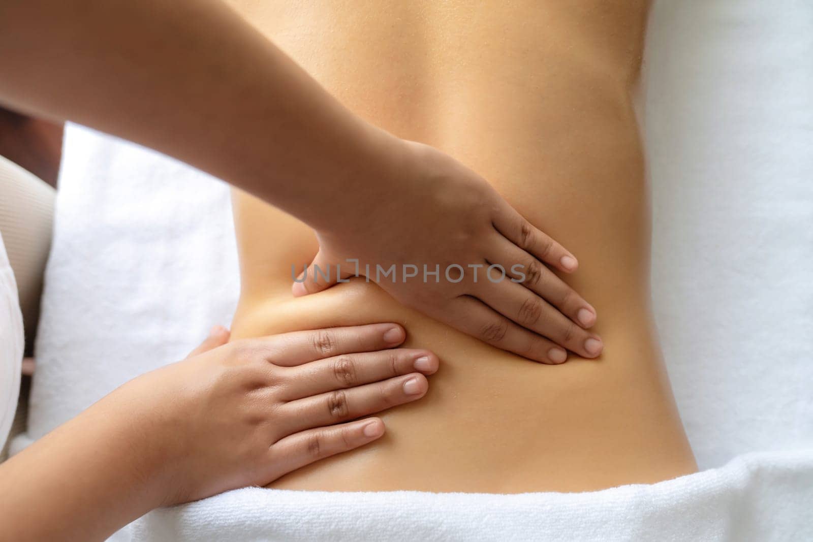 Closeup woman customer enjoying relaxing anti-stress massage. Quiescent by biancoblue