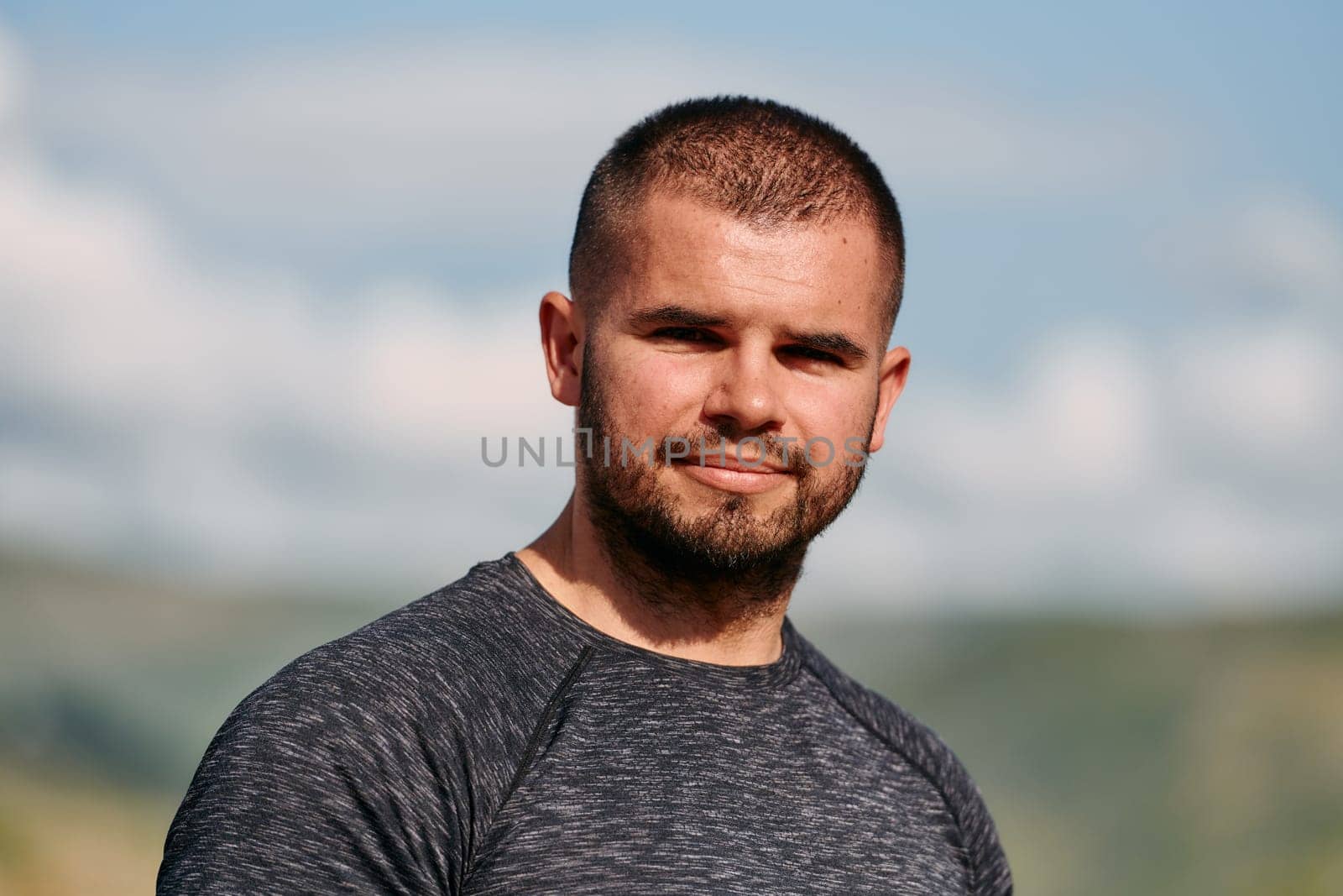 In a close up portrait, a serene man is captured finding solace and tranquility, his calm demeanor reflecting the peaceful aftermath of a rigorous running session.