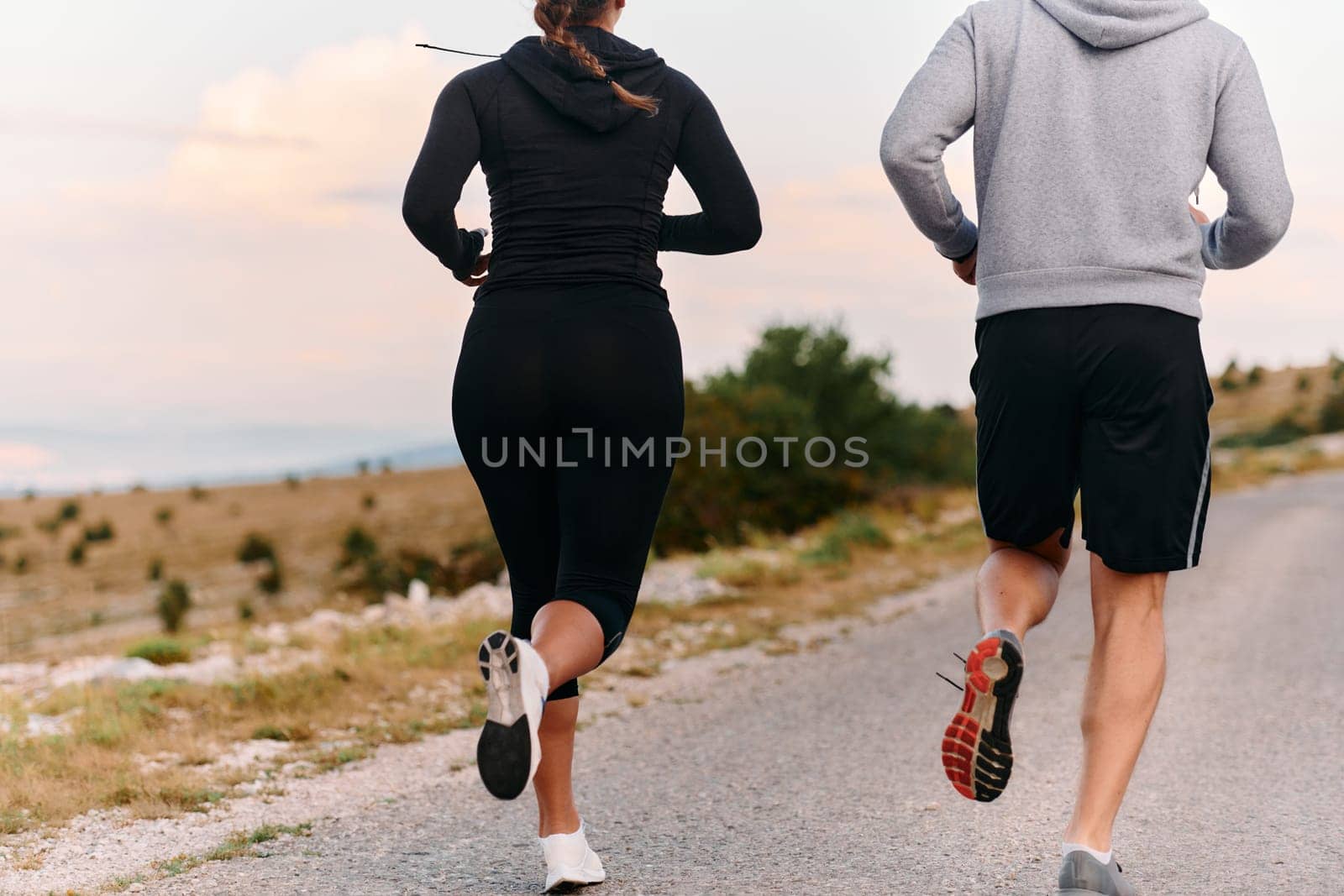 Couple conquer challenging mountain trails during an invigorating morning run.