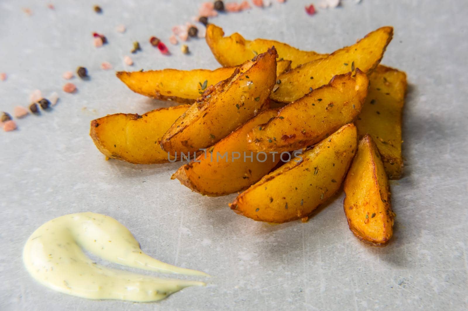 potato wedges on stone background by Mixa74