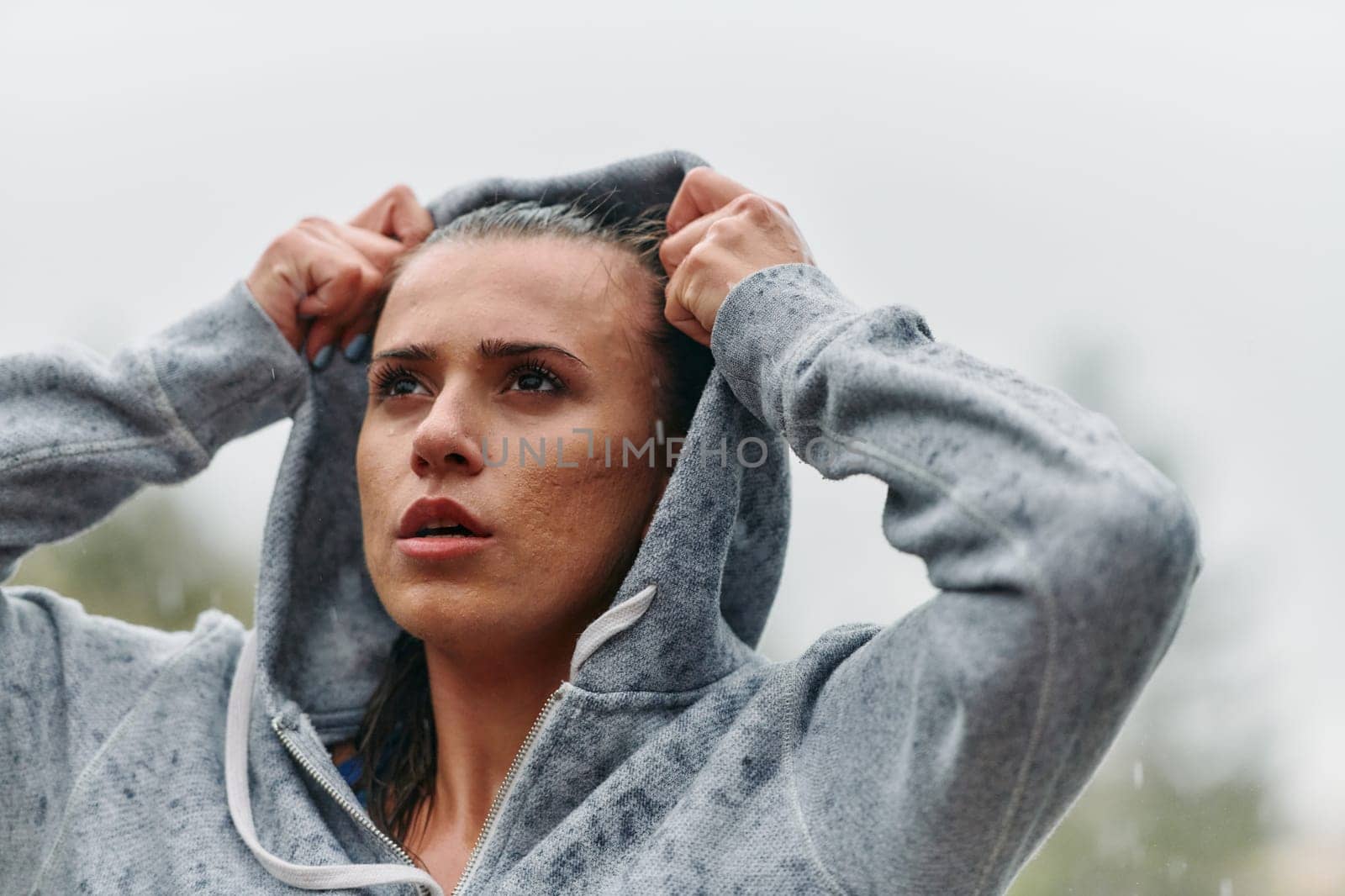 Woman Resting in the Rain After Intense Run by dotshock