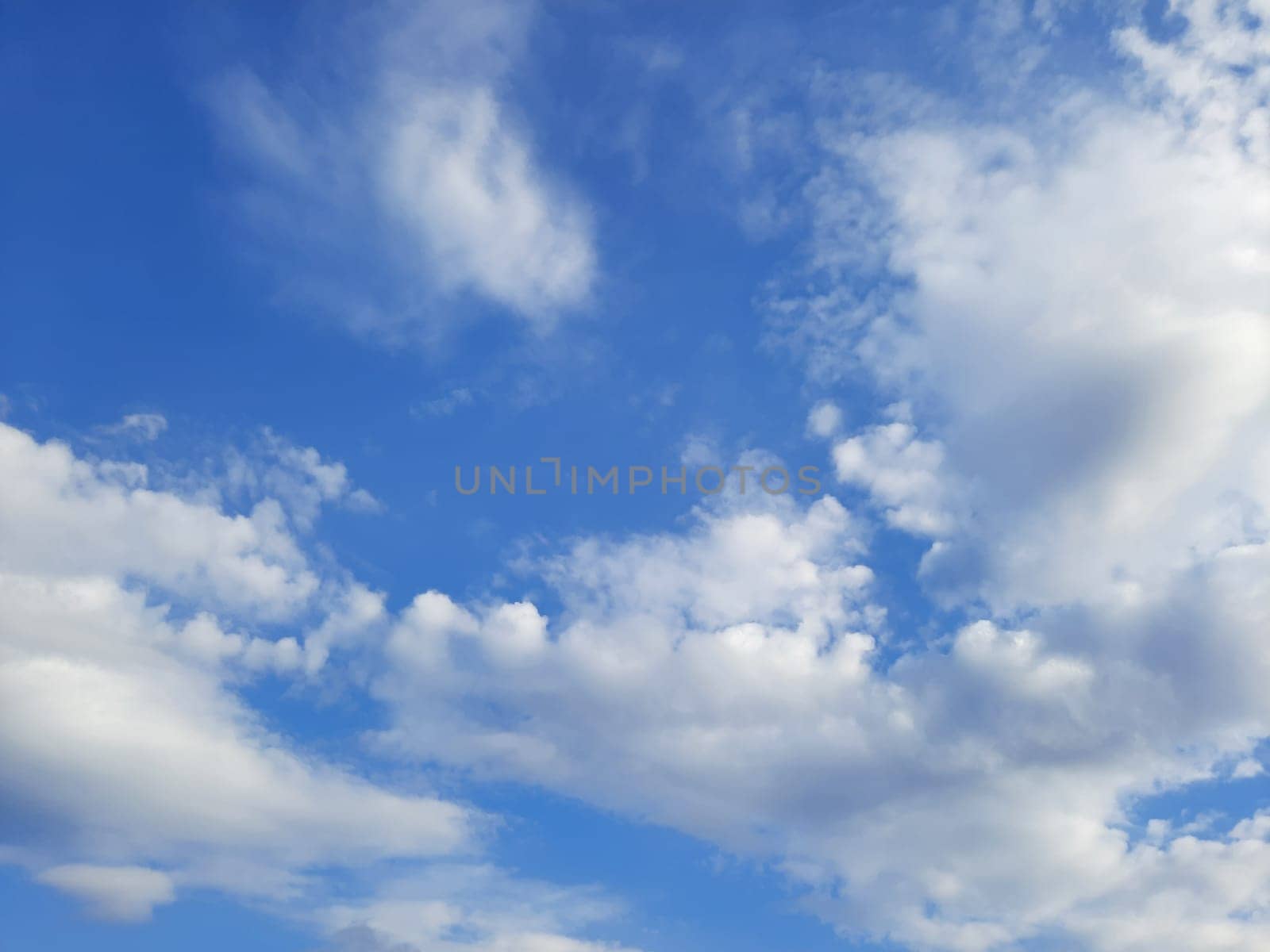 Beauty cloud against a blue sky background. Sky slouds. Blue sky with cloudy weather, nature cloud. White clouds, blue sky and sun. by Costin