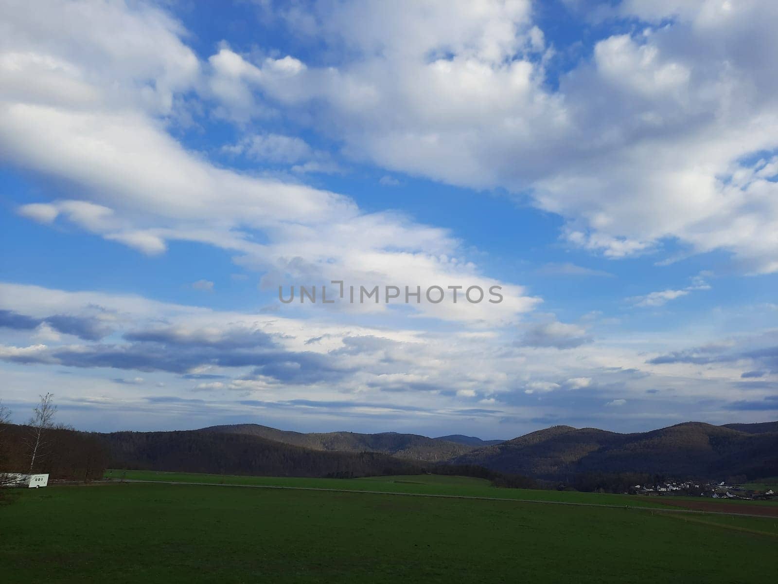 Beauty cloud against a blue sky background. Sky slouds. Blue sky with cloudy weather, nature cloud. White clouds, blue sky and sun. by Costin