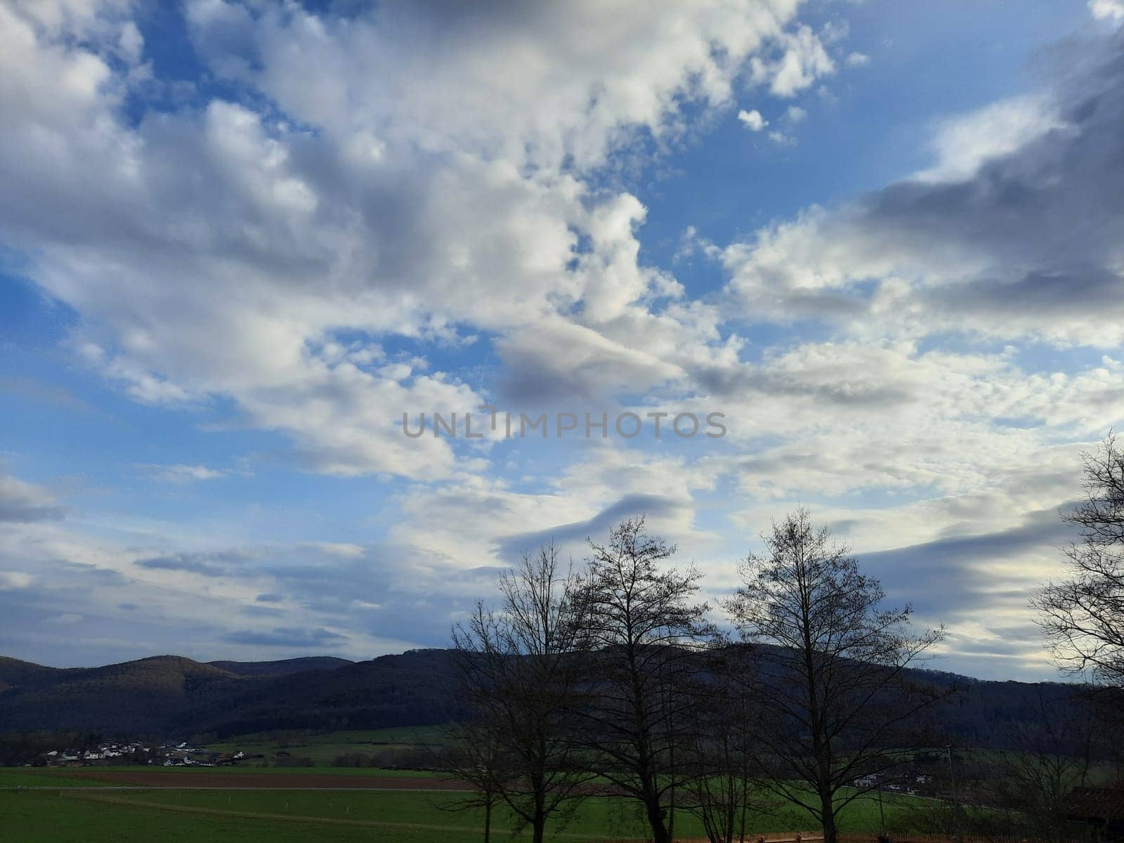 Beauty cloud against a blue sky background. Sky slouds. Blue sky with cloudy weather, nature cloud. White clouds, blue sky and sun. High quality photo