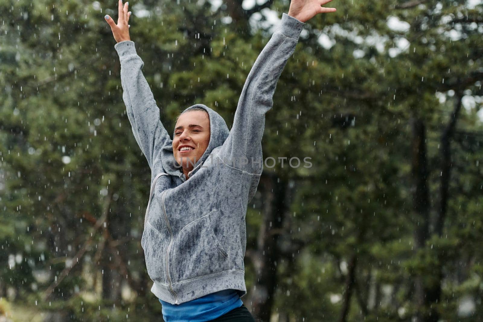 Beautiful Woman Enjoying Rainy Day After Intense Run by dotshock