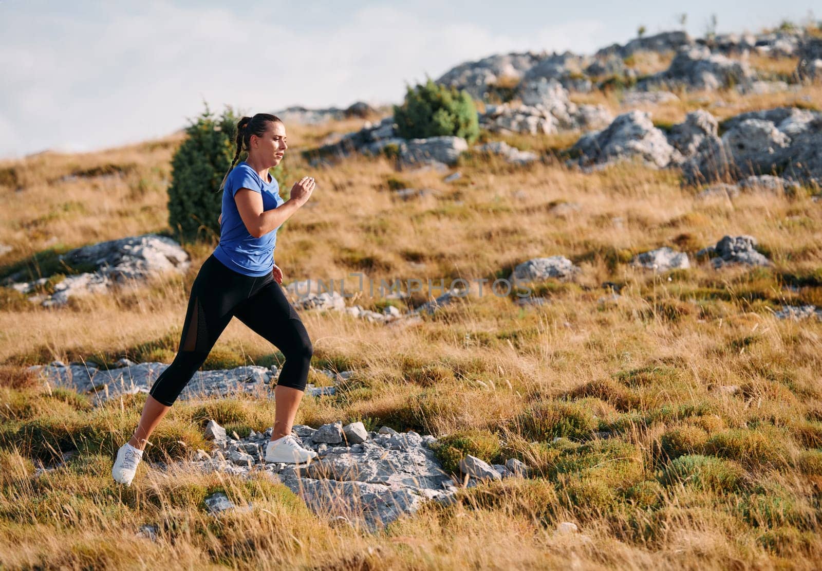 Empowered Runner Embracing Nature's Beauty on a Serene Morning Trail. by dotshock