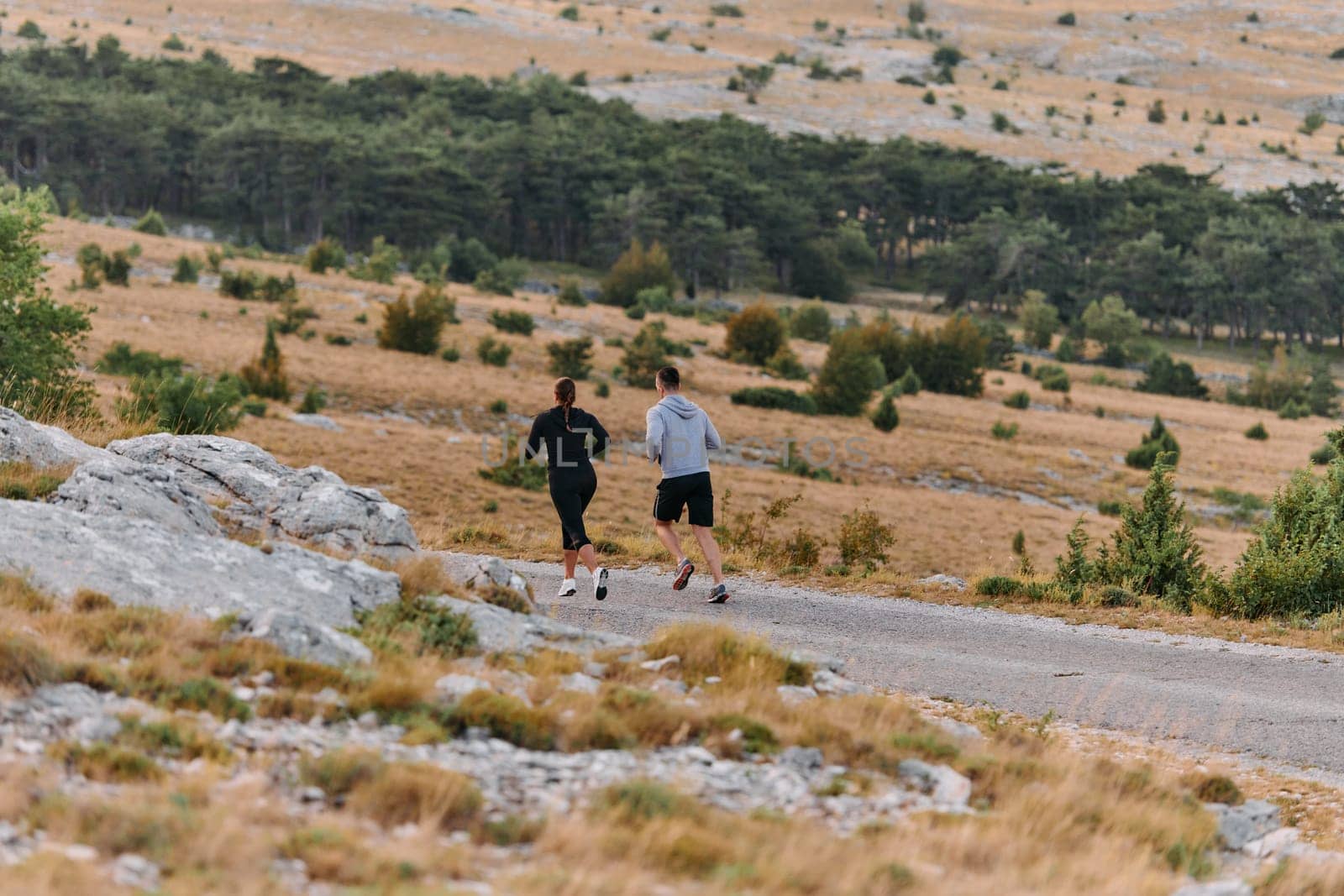 A Couple's Energizing Morning Run in the Mountains by dotshock