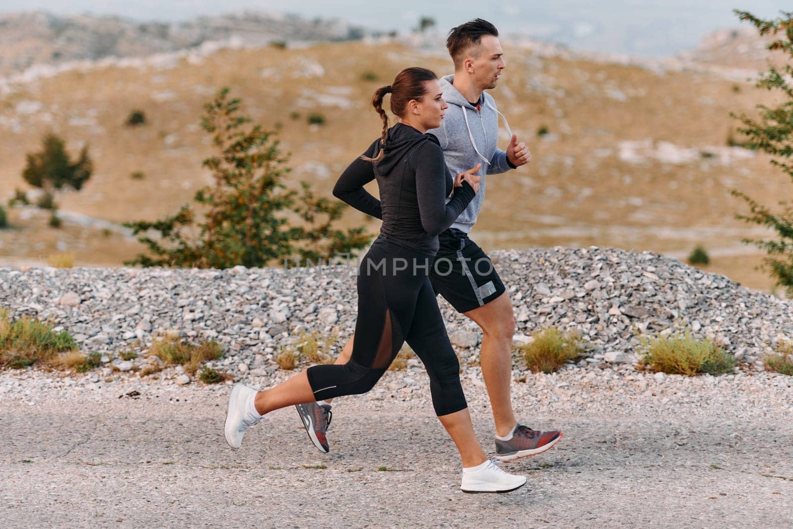 A Couple's Energizing Morning Run in the Mountains by dotshock