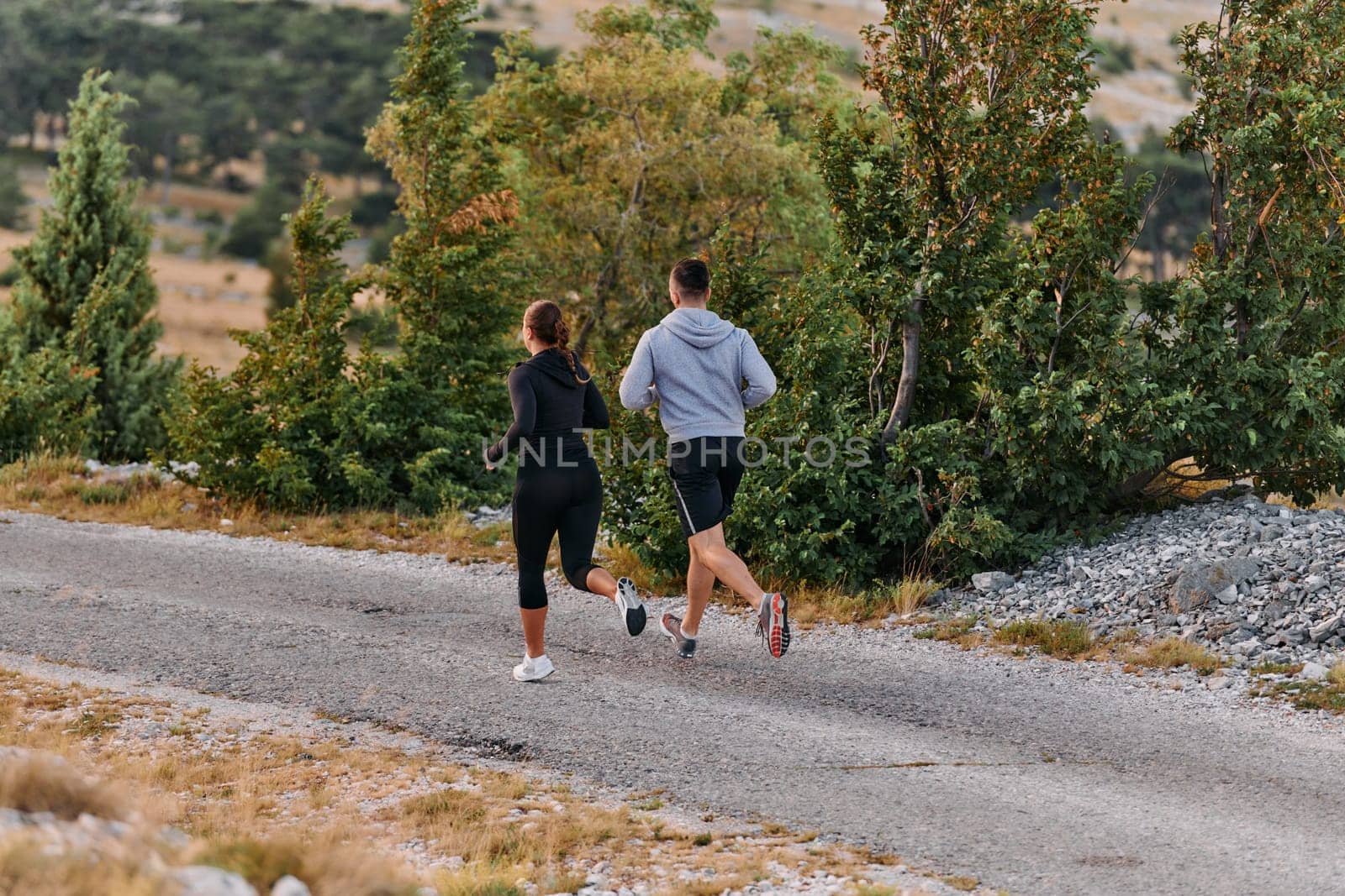 A Couple's Energizing Morning Run in the Mountains by dotshock