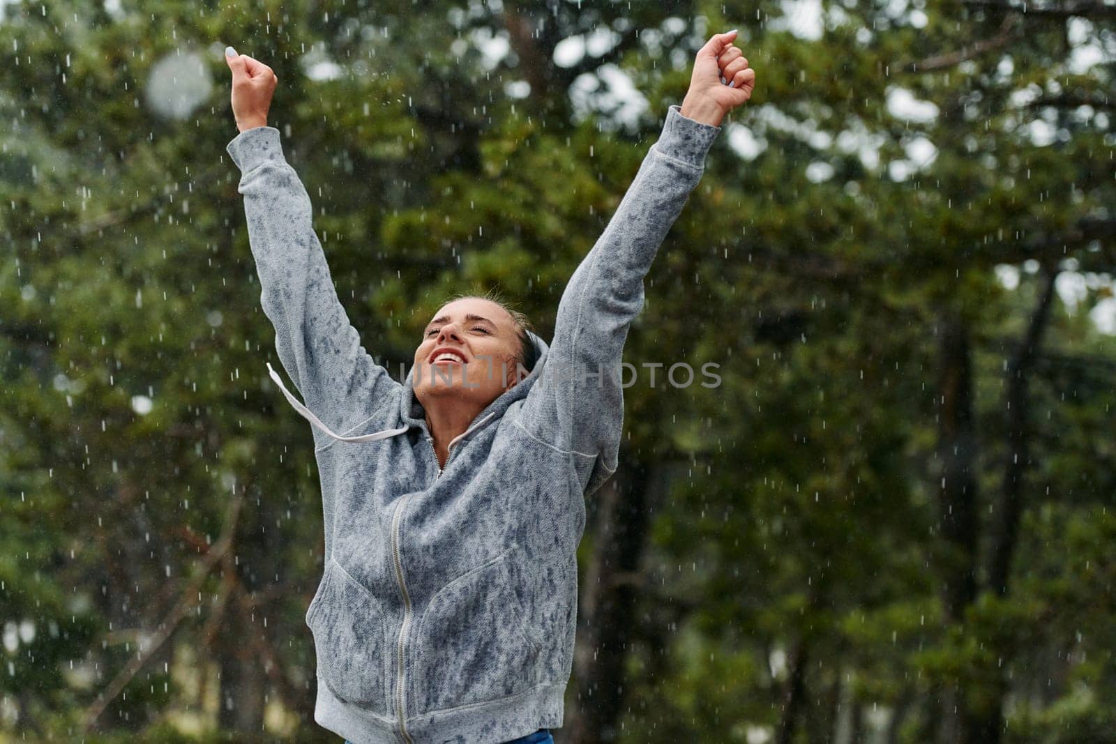 Beautiful Woman Enjoying Rainy Day After Intense Run by dotshock