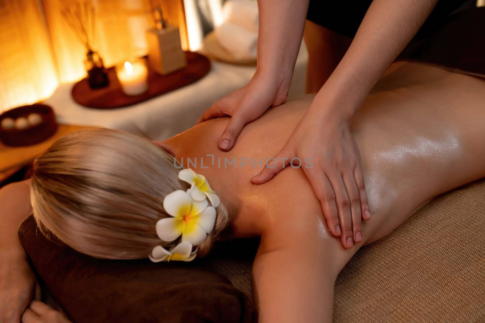 Closeup woman customer enjoying relaxing anti-stress massage. Quiescent by biancoblue