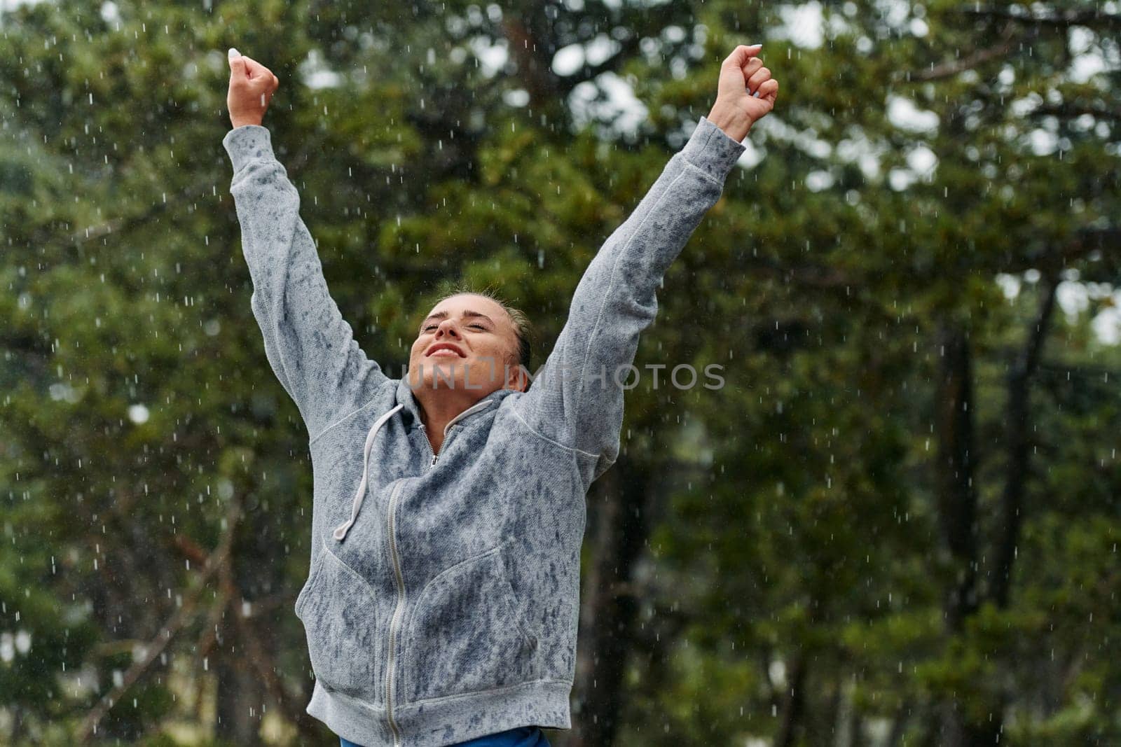 Beautiful Woman Enjoying Rainy Day After Intense Run by dotshock