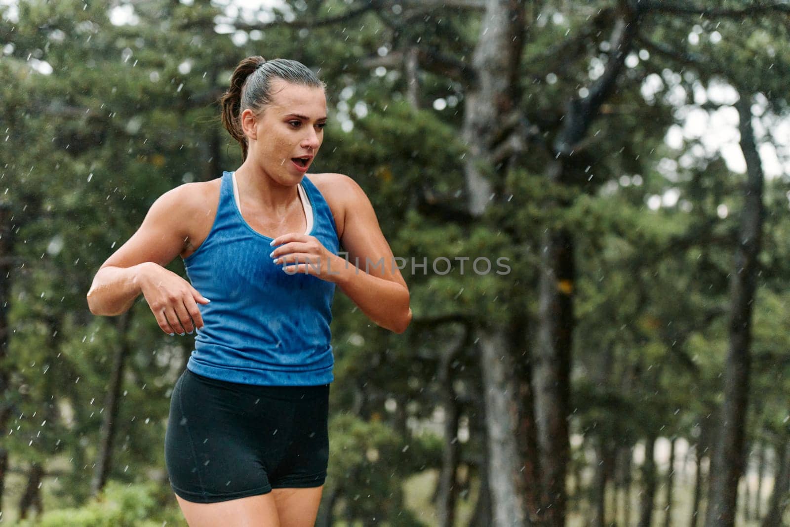 Unstoppable: A Determined Athlete Trains Through the Rain in Pursuit of Marathon Glory by dotshock