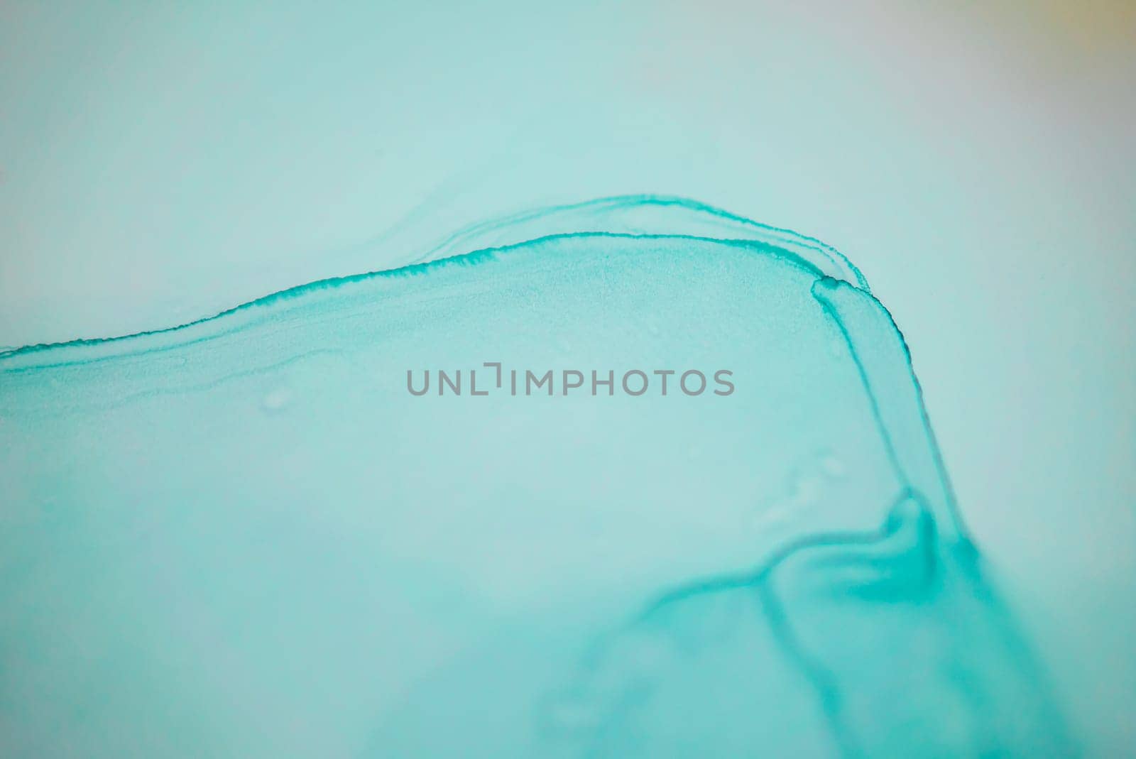 The picture is painted in alcohol ink. Abstraction will perfectly fit into a modern interior. Closeup of the painting. Colorful abstract painting background. Highly-textured paint.