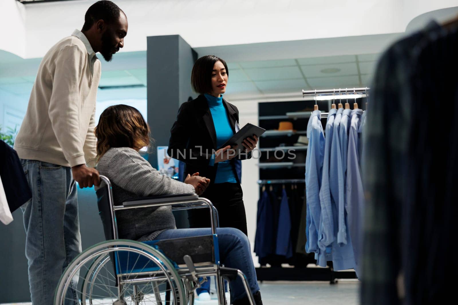 Woman with impairment in clothing store by DCStudio