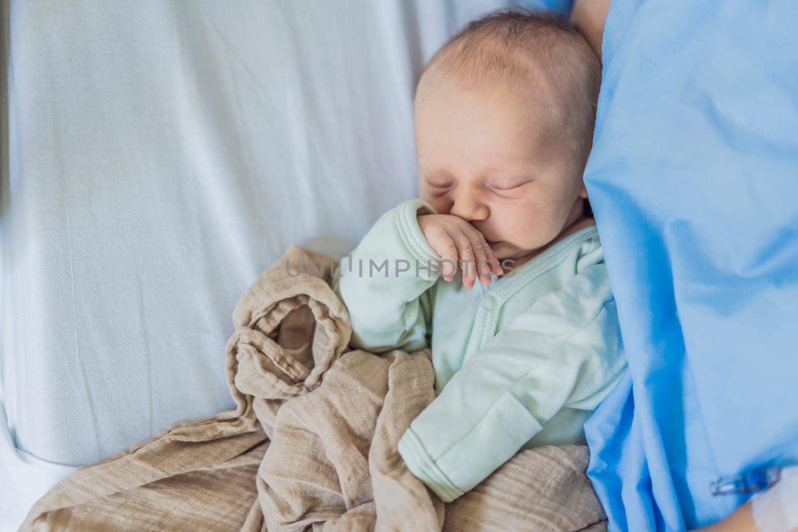 A baby lies with the mother after childbirth, resting peacefully. The serene moment captures the bond between mother and child as they begin their journey together. The hospital environment ensures a safe and comforting space for this intimate interaction.