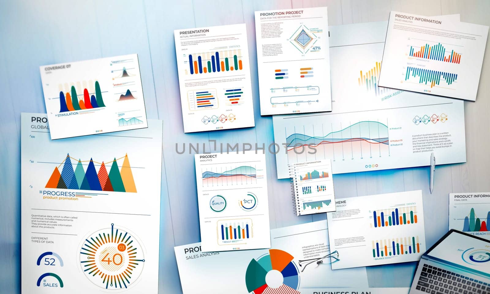 Top view of documents with business data charts on an office desk.