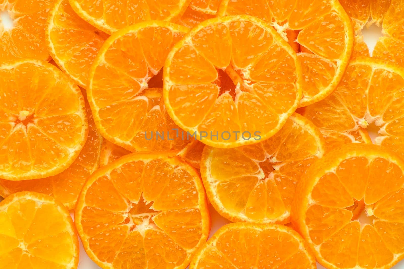 studio photo of cut tangerines as a background 3