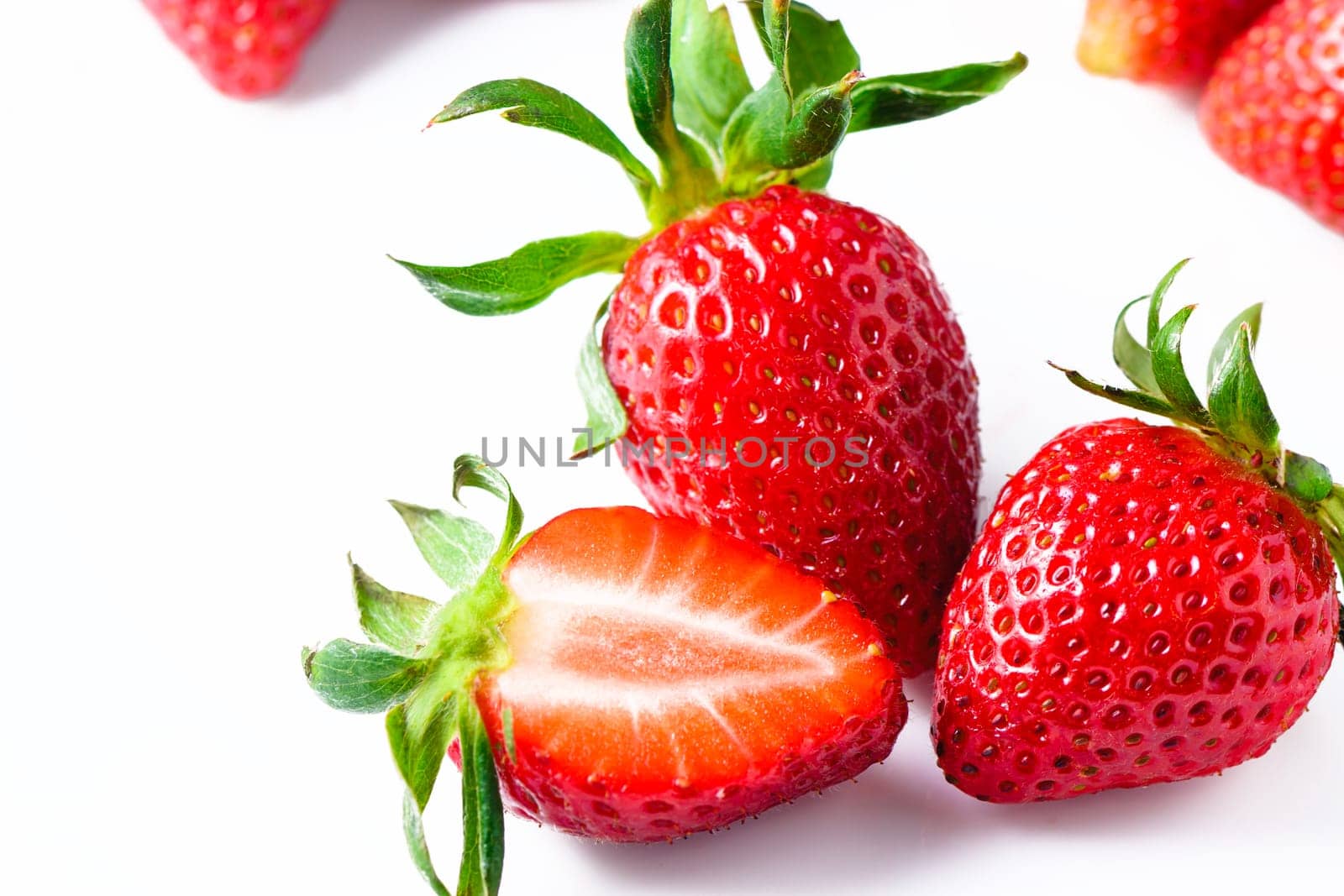 Set of ripe whole strawberries and cut strawberries isolated on white background. 3