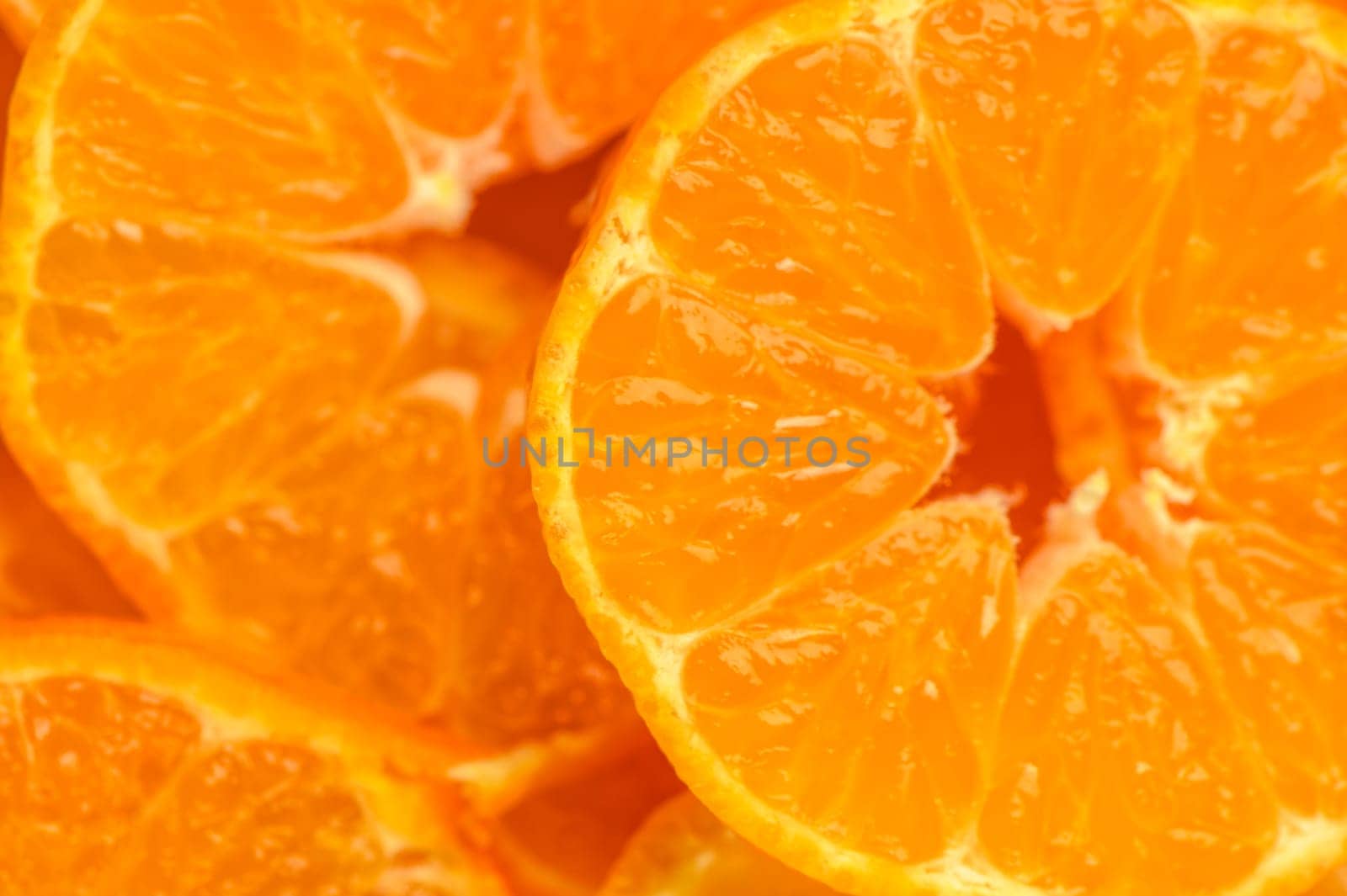 studio photo of cut tangerines as a background by Mixa74