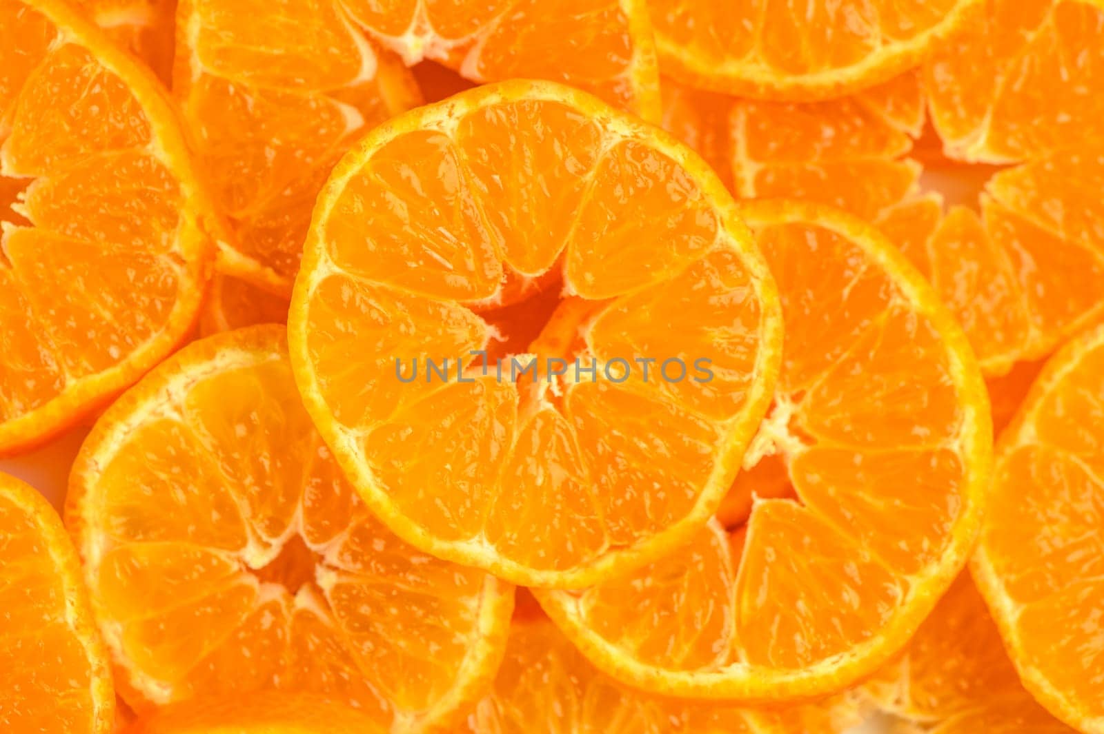 Texture of sweet cut tangerines as background 2 by Mixa74