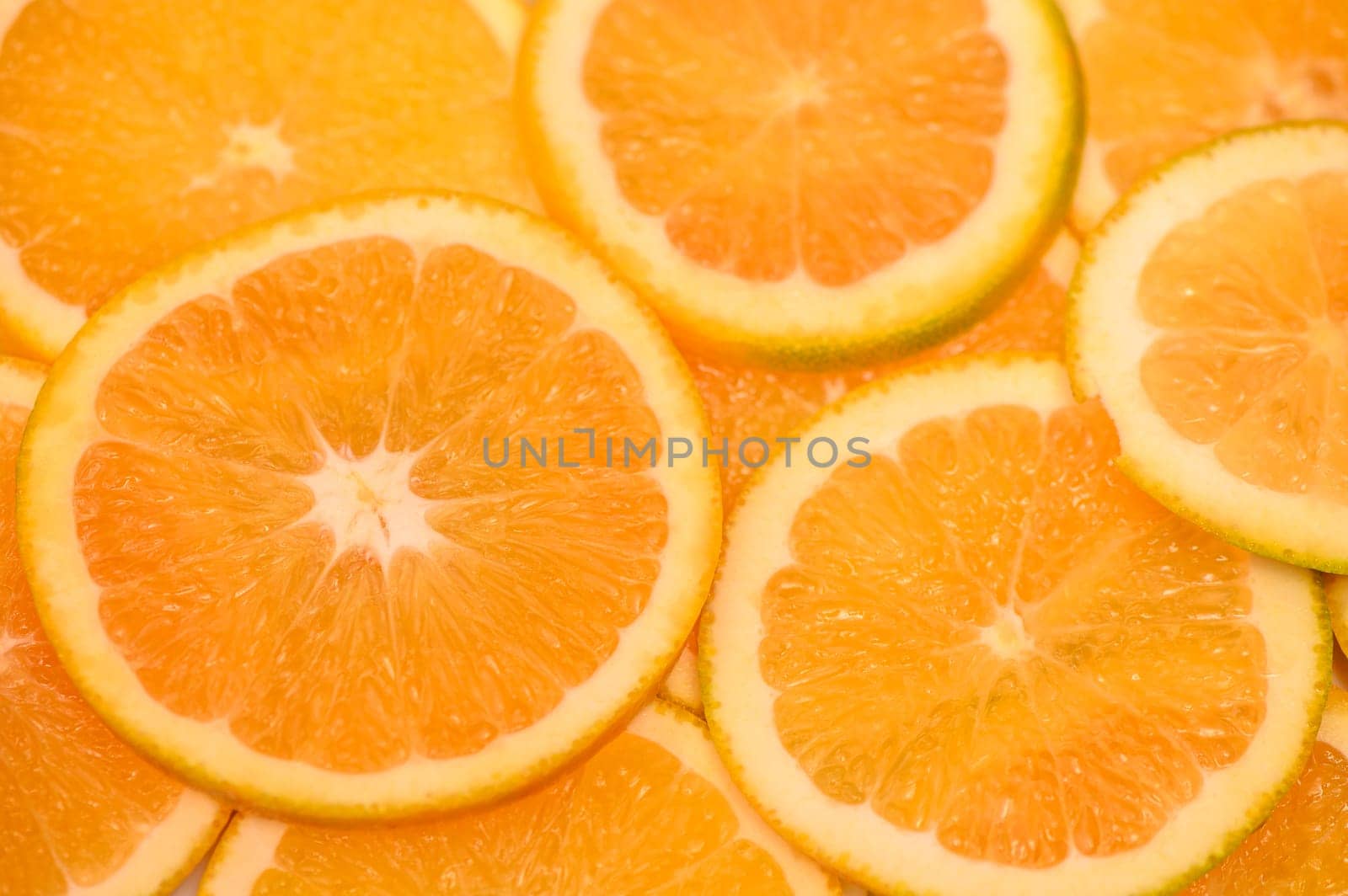 Orange background. citrus fruit. Orange slices texture. Healthy food concept by Mixa74