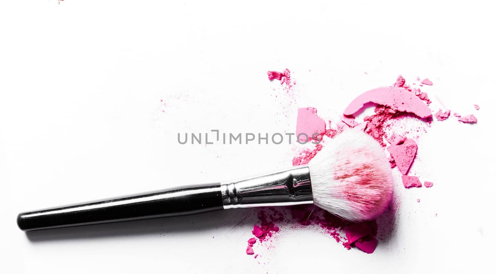 Beauty texture, cosmetic product and art of make-up concept - Brush with crushed eyeshadow and powder close-up isolated on white background