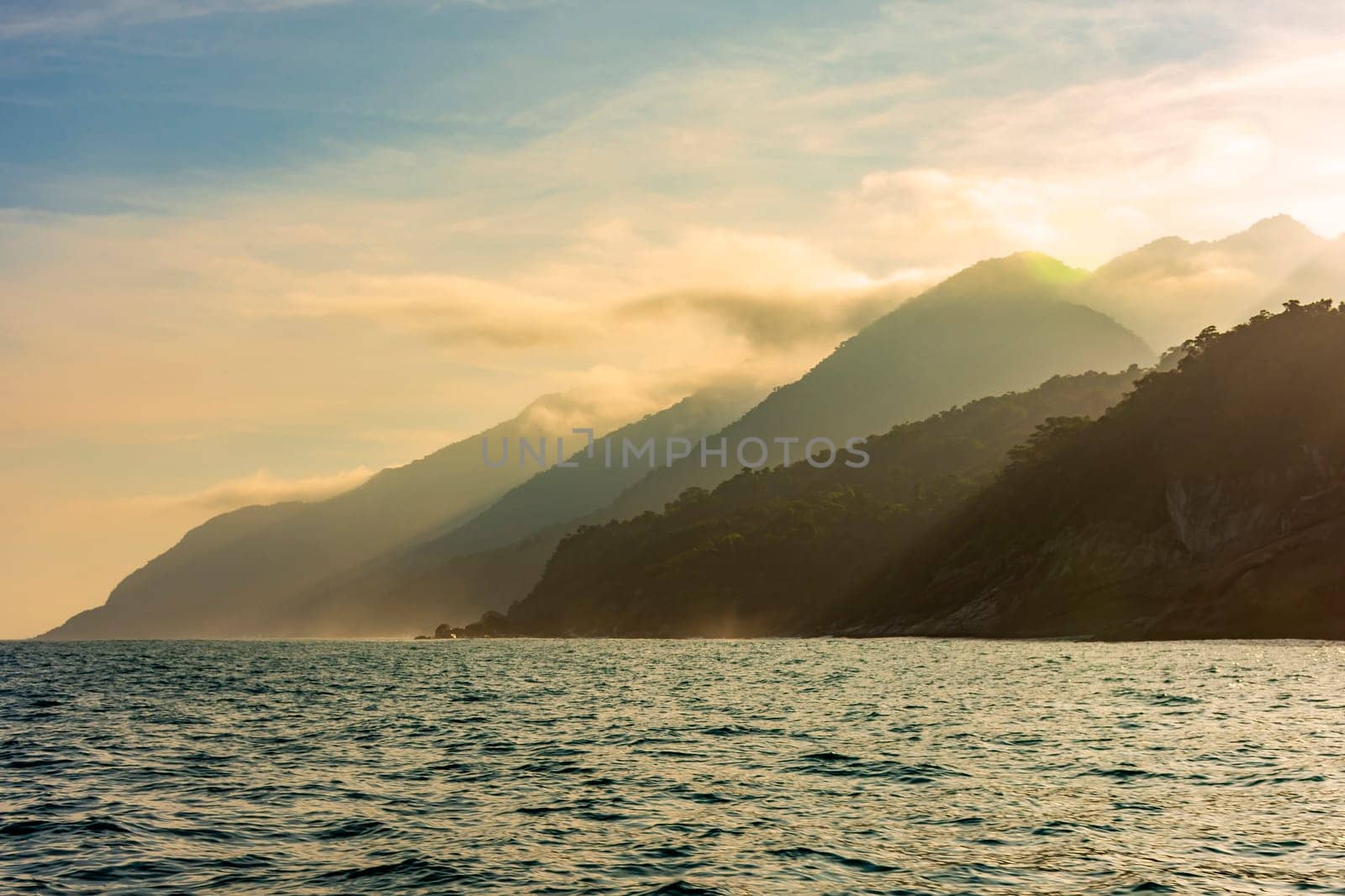 Big mountains, forests and sea on the island of Ilhabela on the north coast of Sao Paulo during sunset