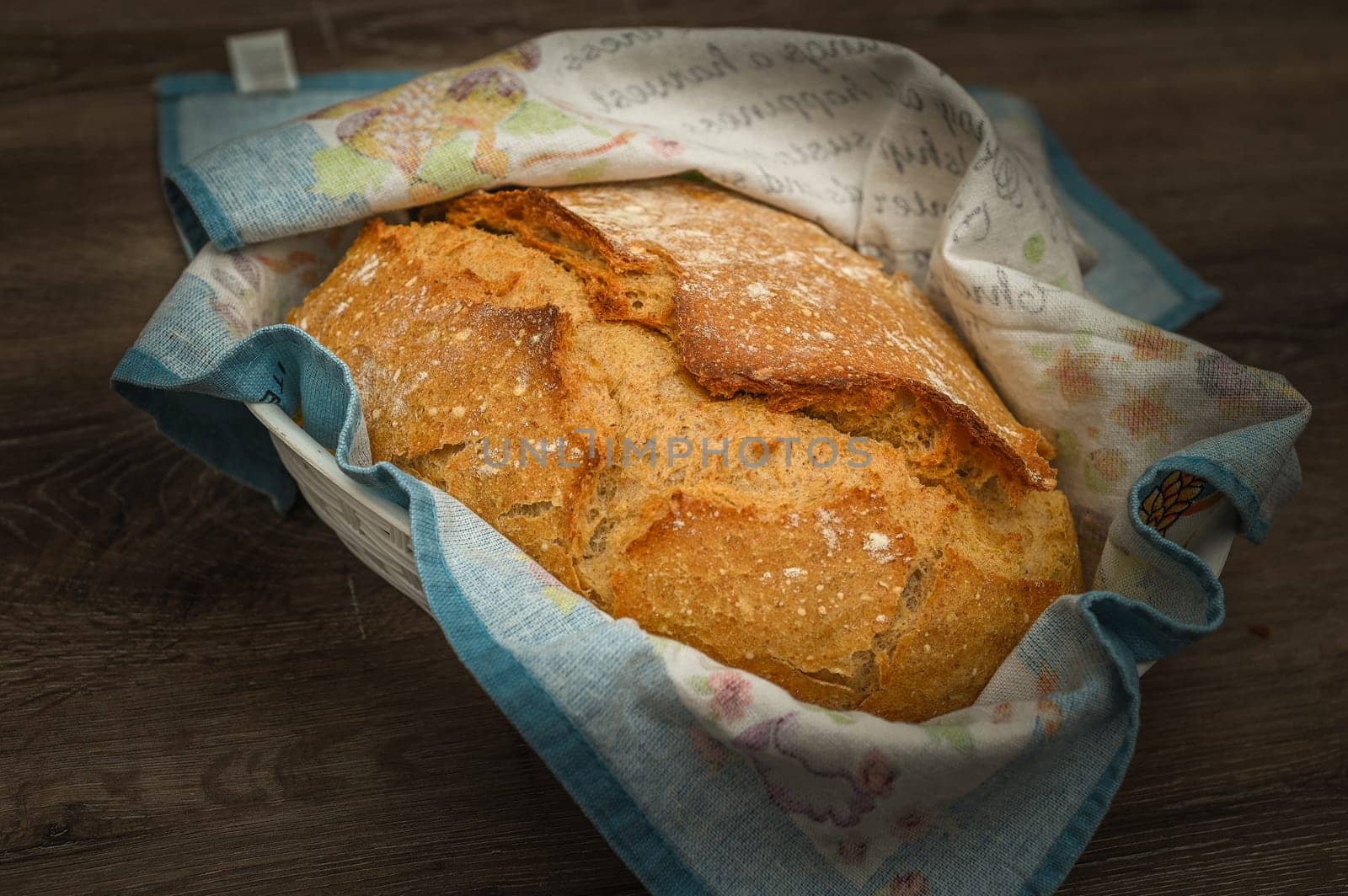 Homemade artisan bread on white wood rustic dinner table by Mixa74