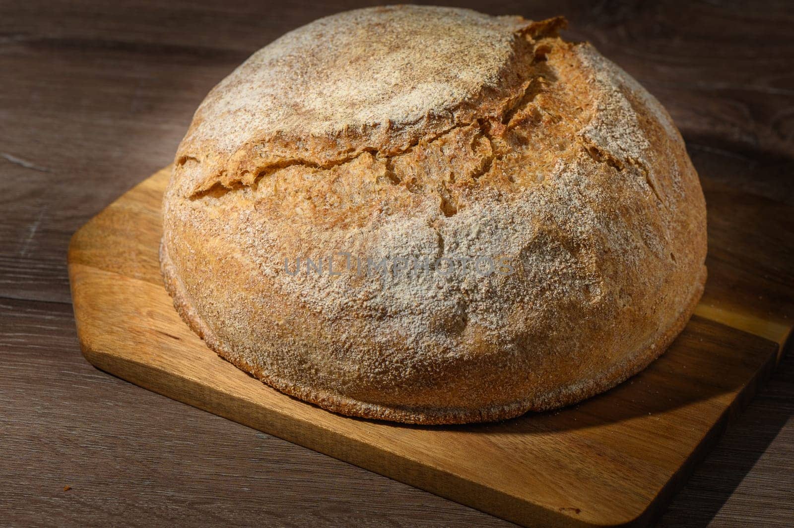 Loaf of bread in bread tin on kitchen table 2