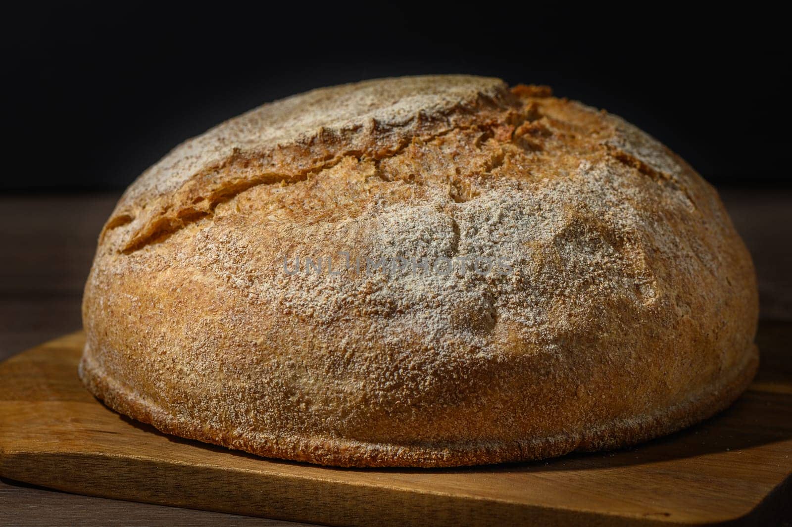 Loaf of bread in bread tin on kitchen table by Mixa74