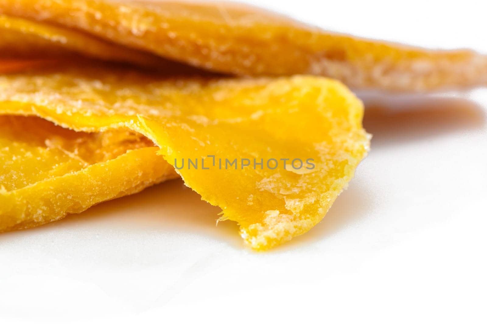 Pile of dried mango slices cut out on transparent background 2