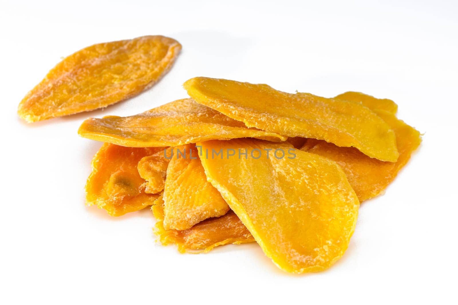 Dried mango slices on white background by Mixa74