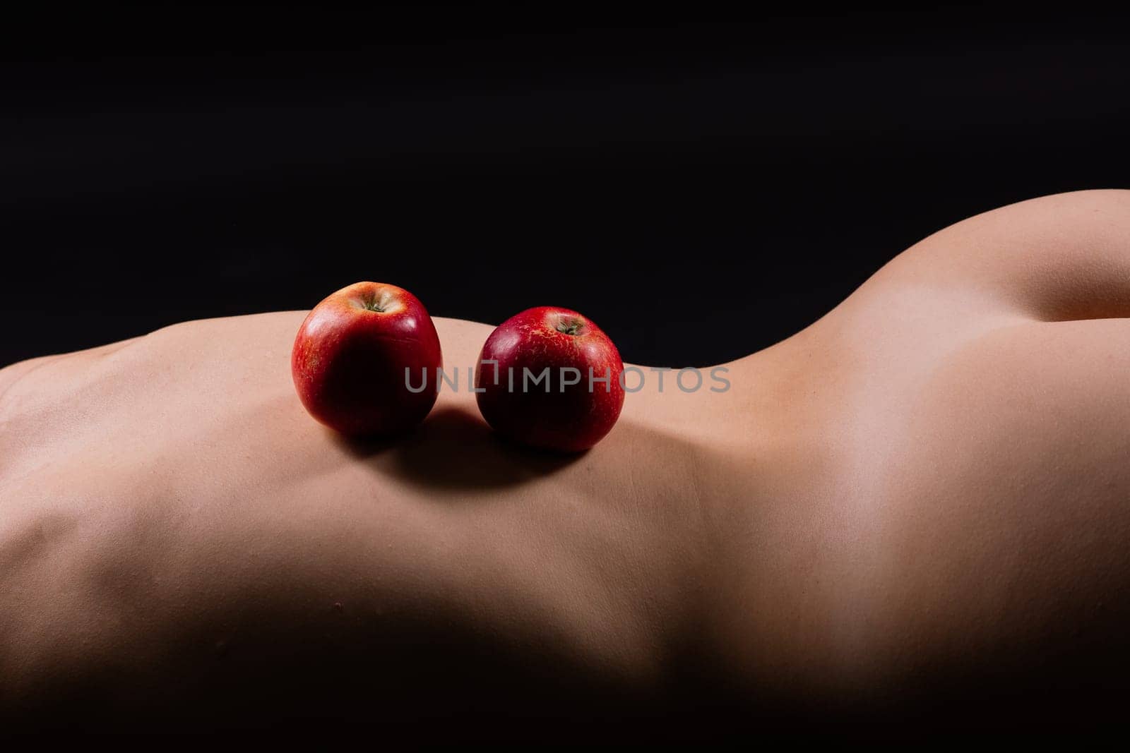 Red apple of Beautiful female body. Seductive booty of young woman. Naked woman by Zelenin