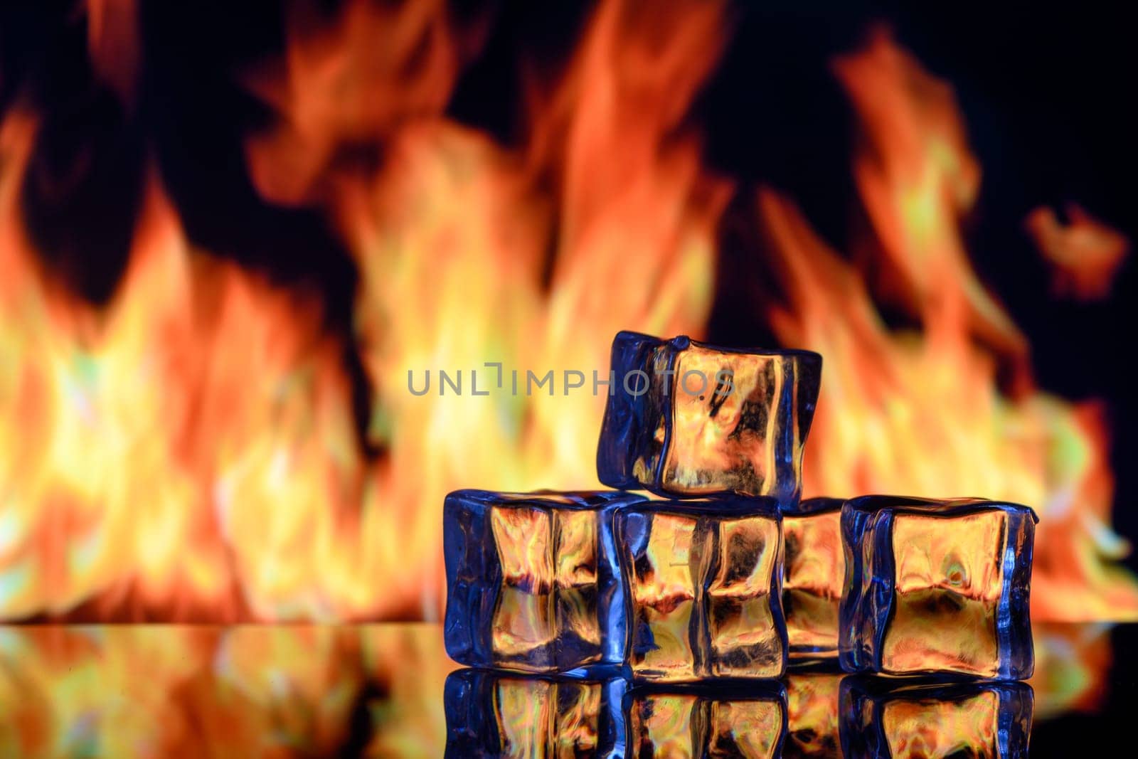 ice cubes on a black background in flames 7