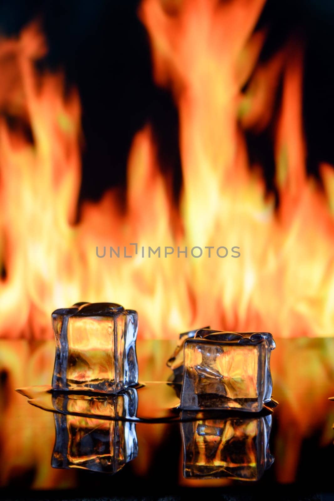 fire and ice cubes on a black background, place under the text 6