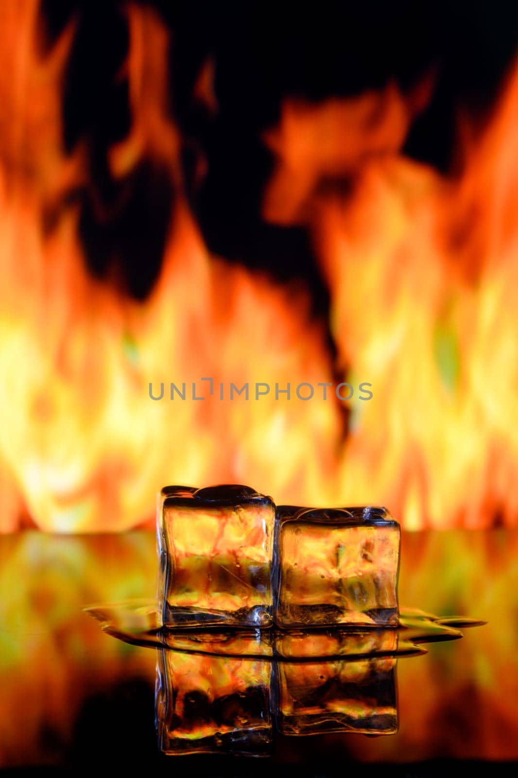 fire and ice cubes on a black background, place under the text 2 by Mixa74