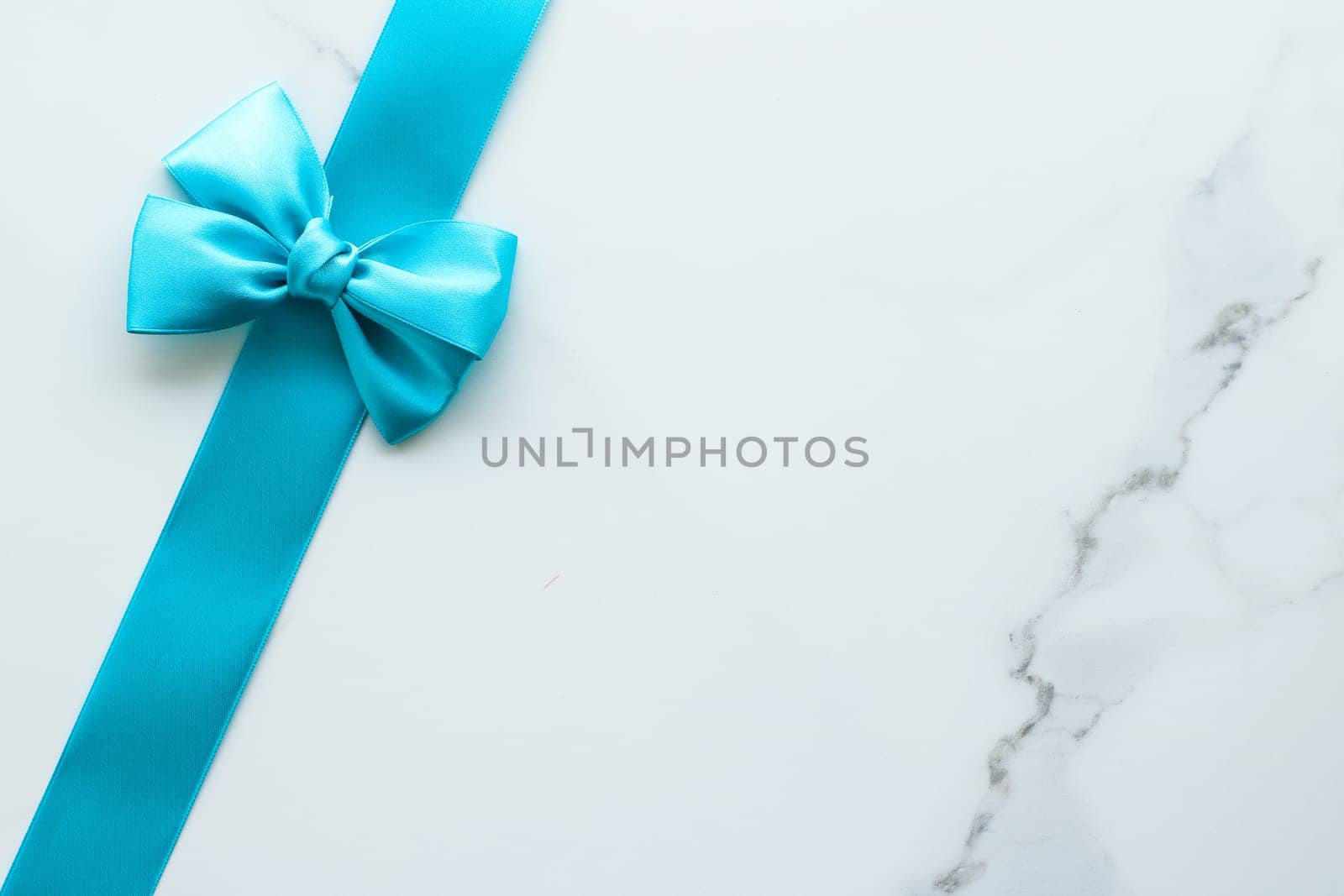 Holiday decor, feminine design and flatlay concept - Blue silk ribbon on marble, top view