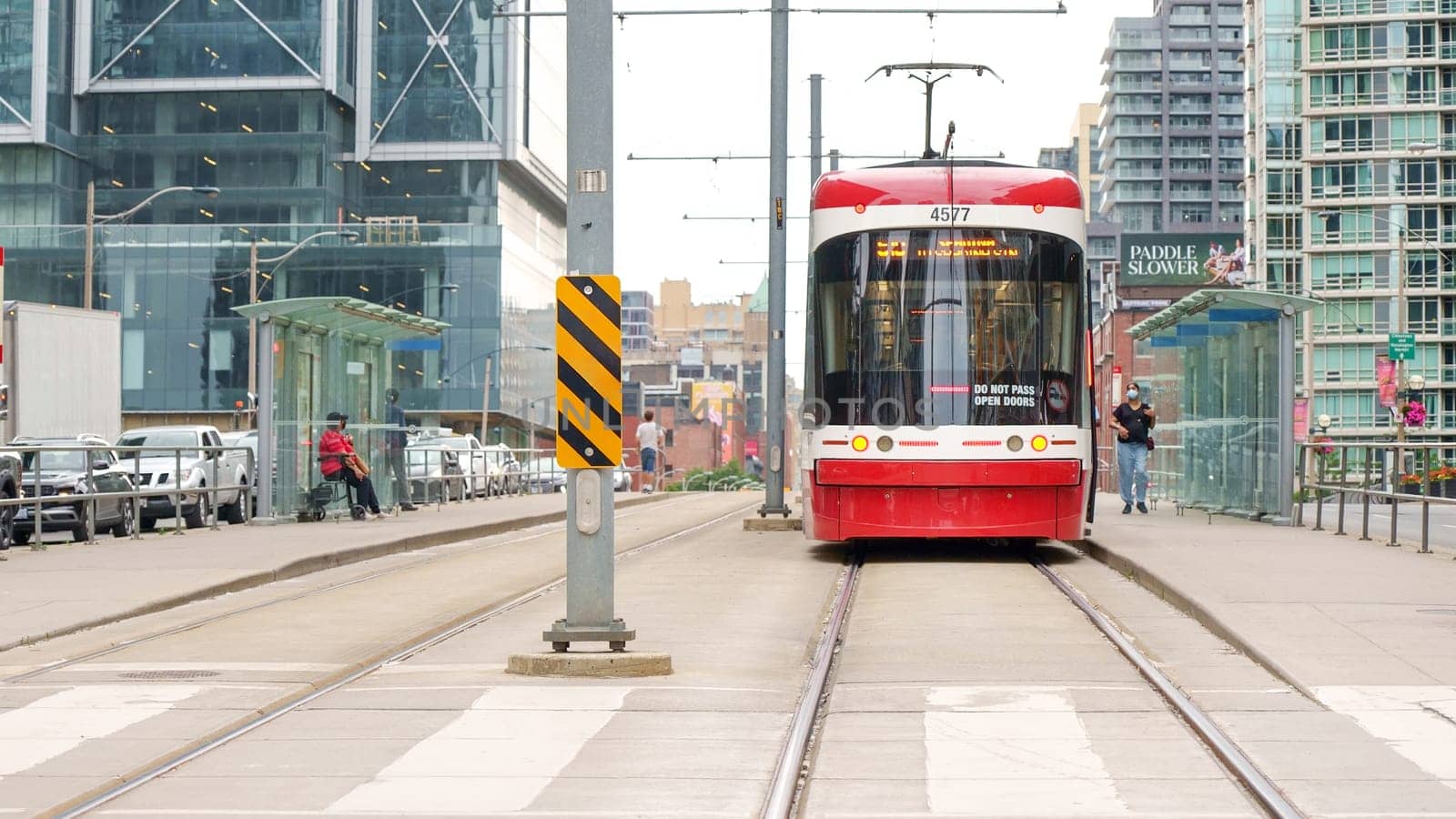 Street view of new TTC Bombardier-made streetcar in downtown Toronto's entertainment district. New Toronto Transit Commission tram on streets of Toronto. TORONTO, ON Canada - July 4, 2022..