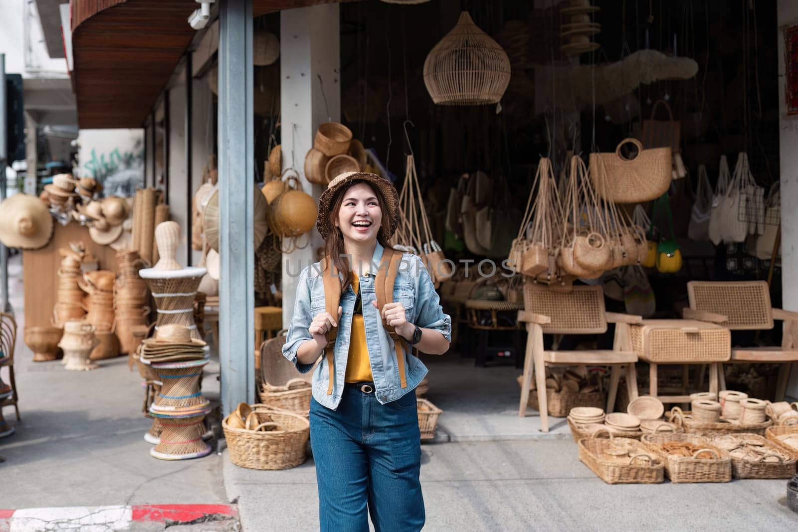 A cheerful traveler enjoying a day at a local market filled with handcrafted goods, showcasing the vibrant urban culture.