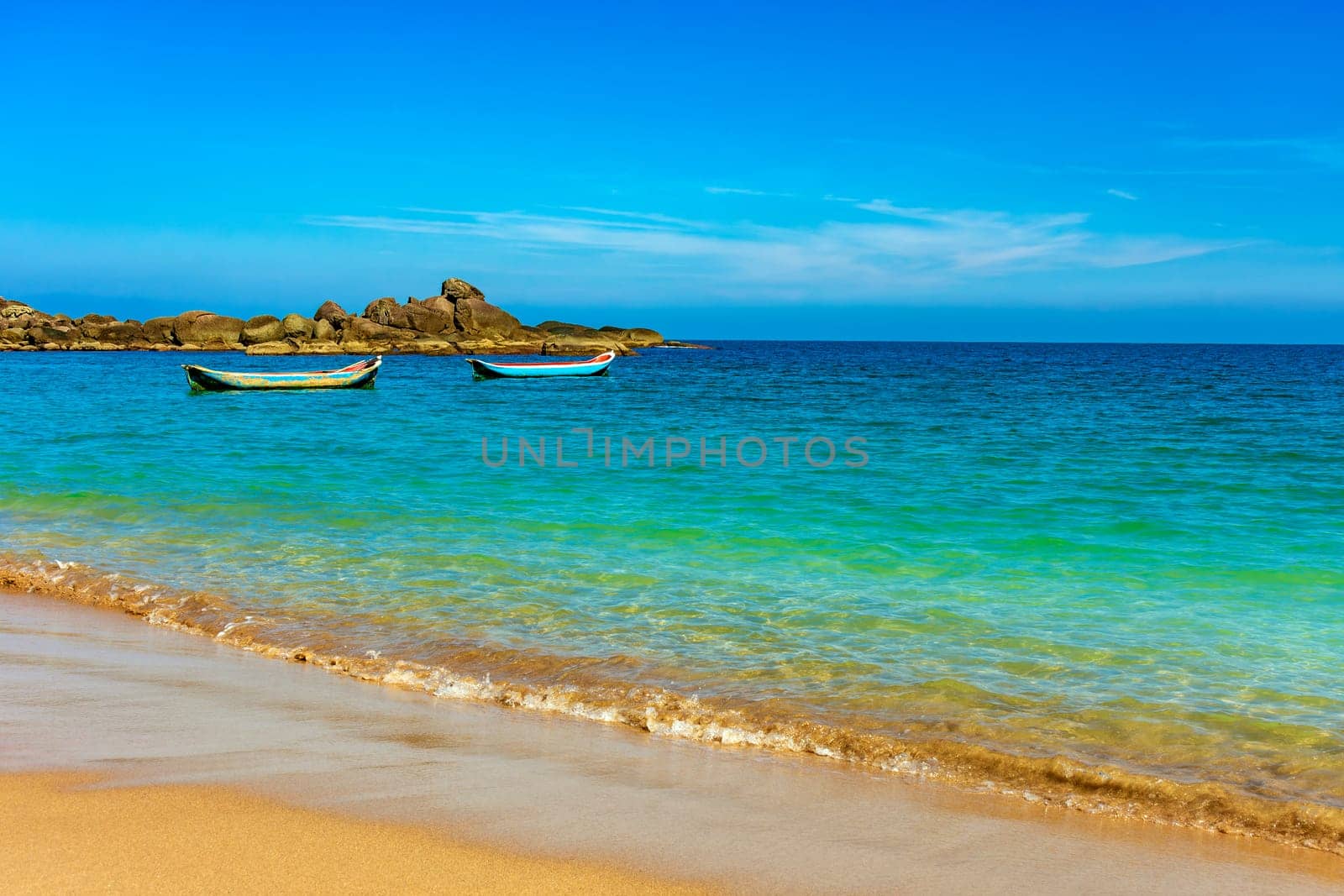 Primitive fishing canoes on the sea waters by Fred_Pinheiro