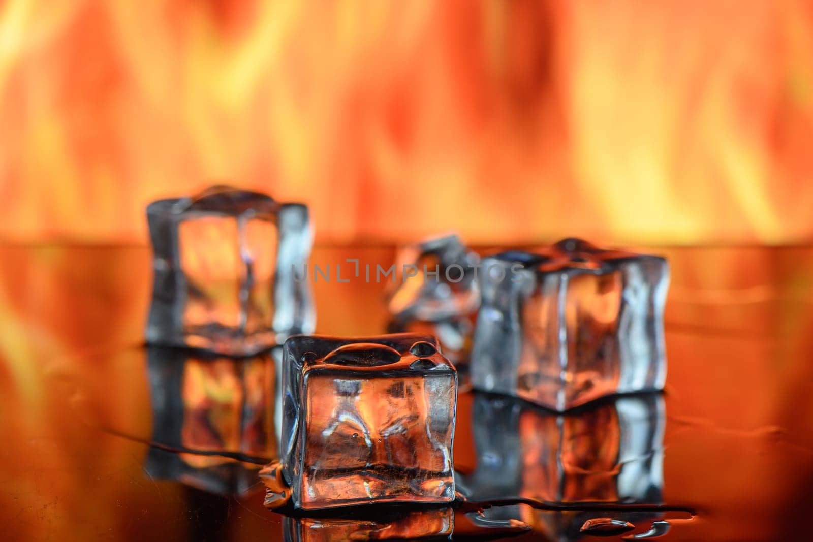 Ice melting with flames on background. 4