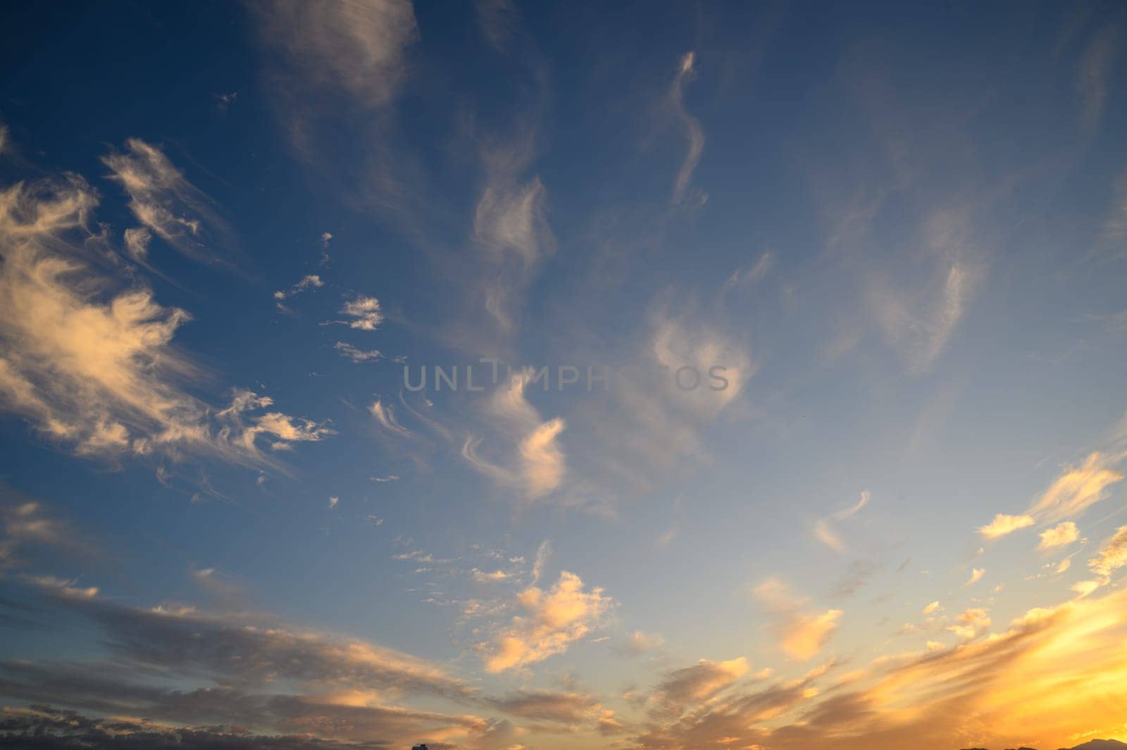 The gathering clouds during sunset create abstract painting patterns in the western sky. 1 by Mixa74