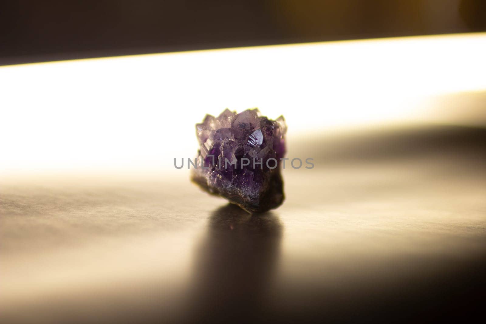 Violet amethyst quartz crystal on black background by VeronikaAngo